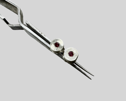 Forged round studs with garnets sterling silver